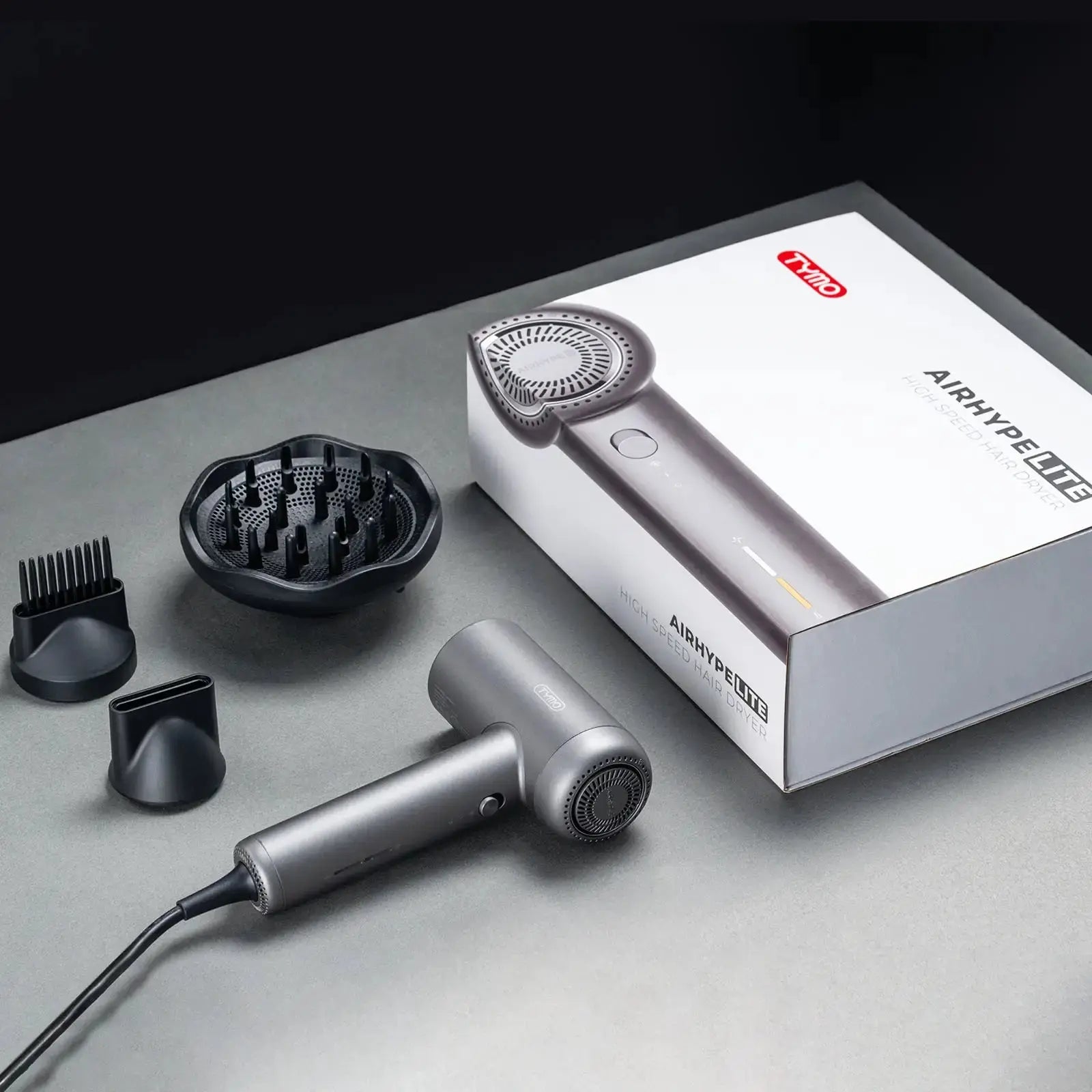 TYMO AIRHYPE LITE packaging with smoothing hair nozzle, comb attachment, curls diffuser
